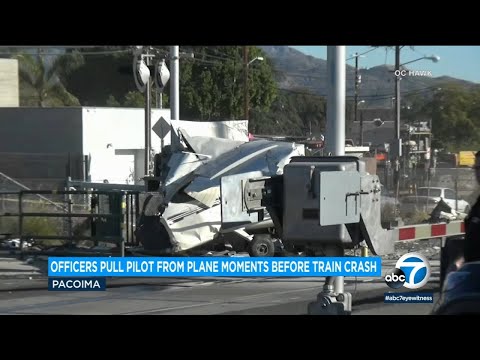 Pilot pulled from crashed plane in Pacoima moments before train slammed into aircraft | ABC7 Video Thumbnail