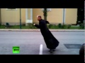 Skateboarding priest shows class in Hungary