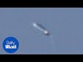 Photographer captures 'pill-shaped' UFO in the sky!!