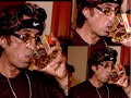 Shakti Kapoor drinking and smoking at a Bollywood party in Mumbai