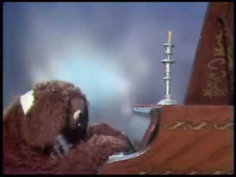 Rowlf the Dog and Fozzie Bear with a candelabra