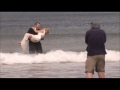 Bride drop - prankster groom throws bride in freezing north sea, without sound