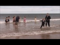 Bride drop - prankster groom throws bride in freezing north sea, without sound