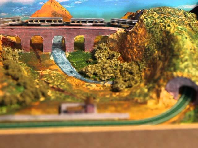 Train even smaller than T-gauge! Railway (railroad) layout in a book.