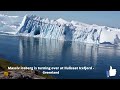 Incredible moment when an iceberg flips over in Greenland