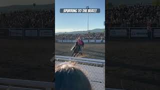 Cowboy Spurring Horse To The Beat Of The Music