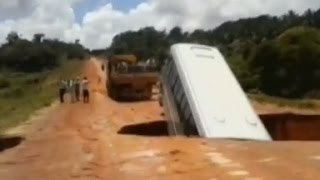 A brazil tourist bus fell through a large crater hole, washed away by flood
