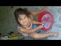 A 3 year old girl washing her underwear