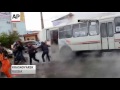 Raw: Hot-Water Pipe Bursts Under Bus in Russia