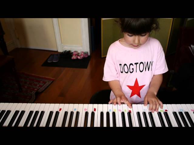 Stella plays Do You Want To Build A Snowman? on piano