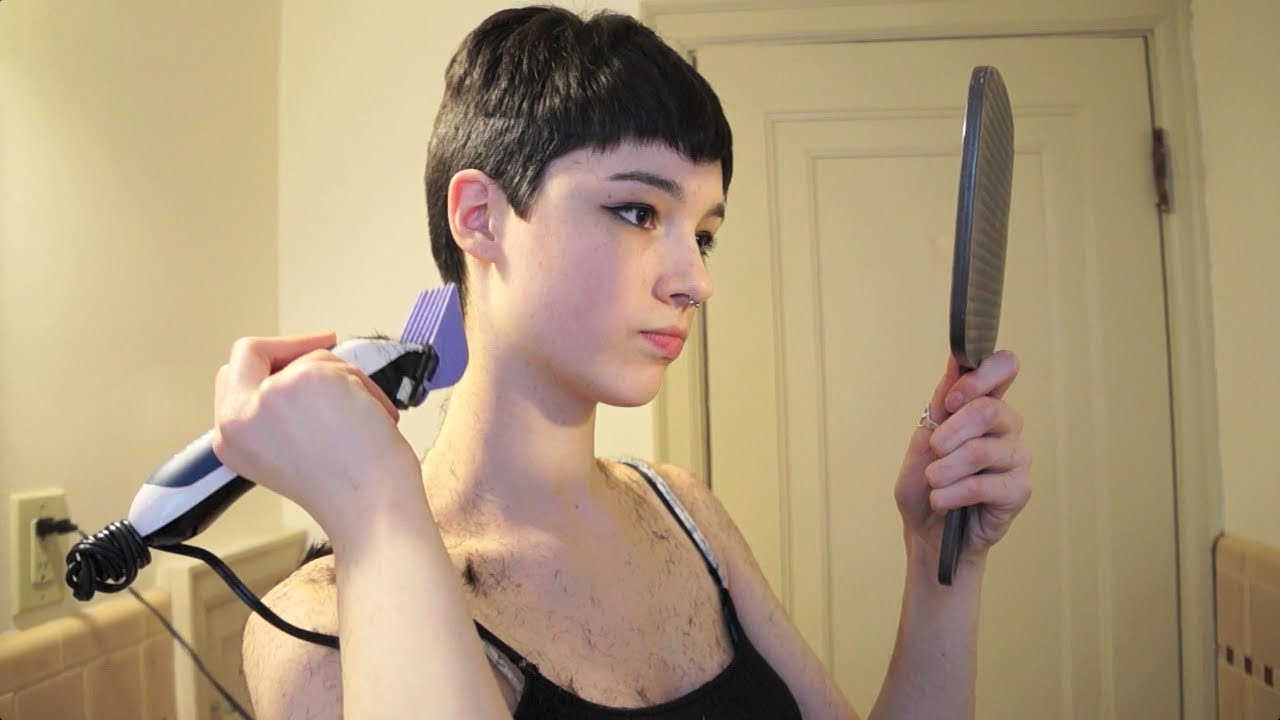 Short haired beauty plays with fan images