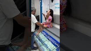 Woman Is Ticklish And Struggles Through Getting A Fish Pedicure