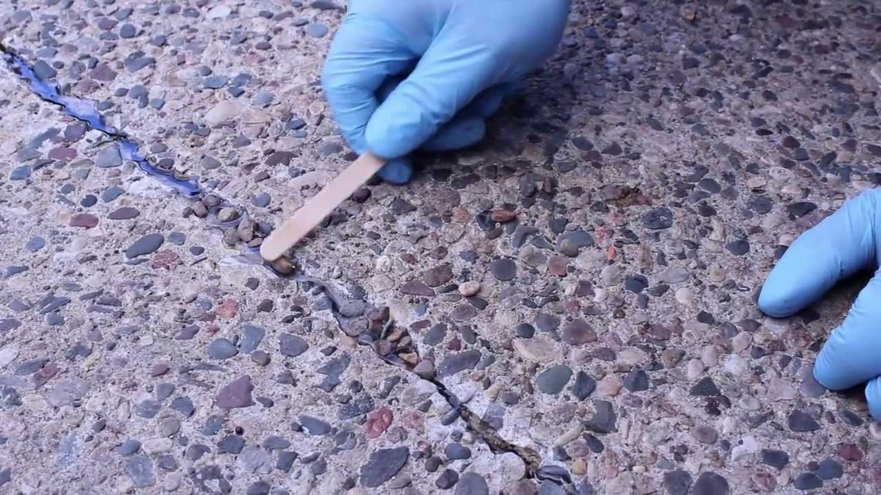 Exposed Aggregate Crack Repair in a Concrete Patio.