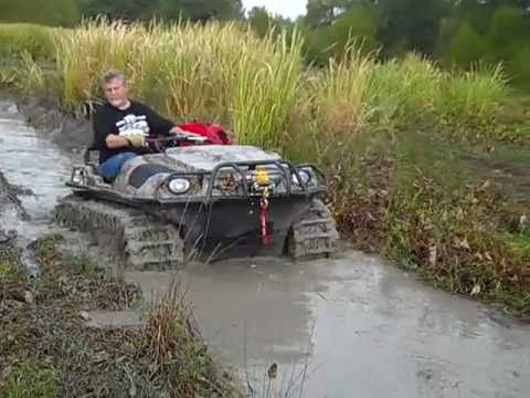 This is My Argo 650 HD with Adair tracks in a bad mud hole ...