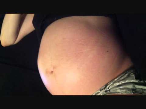 Camgirl pregnant belly movements