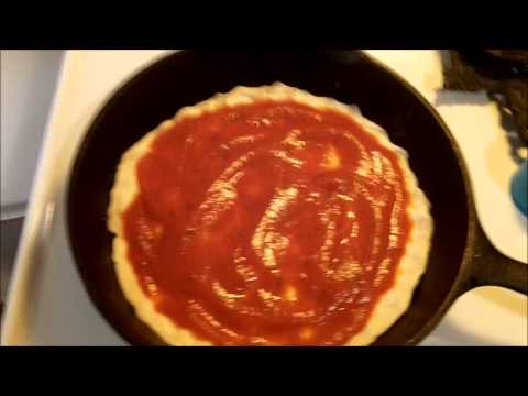 VIDEO : how to make cast iron pizza - yep, it's a redneck pizzeria in my house tonight. ...