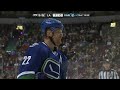Daniel Sedin pulls tooth out after high stick