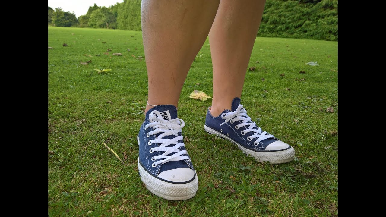 Girl shows sweaty stinky converse sneaker