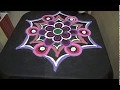 Flower Rangoli Design With Triangle And Round Patterns