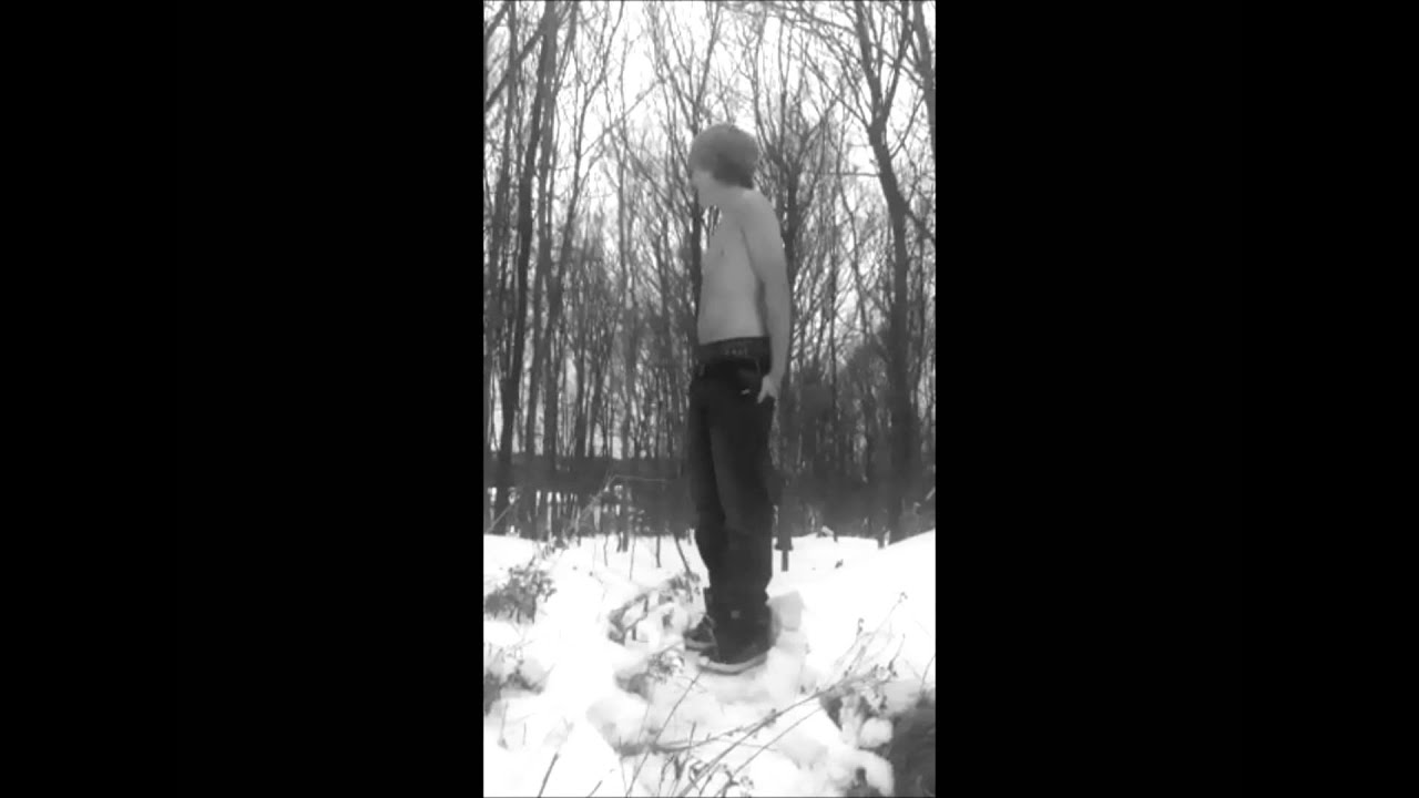 Guy peeing in the woods