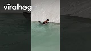 Gliding Down Snowy Slope Into Mountain Water || Viralhog