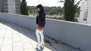 Victoria Devil.brunette Walking With Leather Jacket, Bodysuit, Miniskirt And White High-Heeled Boots