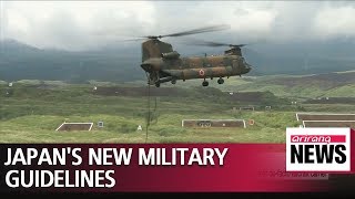 Japan adopts new defense guidelines, agrees to boost military spending over next 5 years