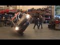 Incredible Stunt Driving...Car Drives on Two Wheels Thru a Shop !