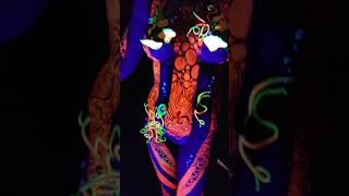 UV Sea Anemone Bodypaint in UV tent for Glastonbury Body Art Festival