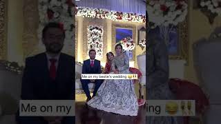 Girl Sitting In Brides Lap