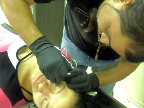 micro dermal piercing being performed at Aztec Ink Tattoos.