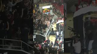 Steph Curry Jumps Into Student Section During A 2019 Game At Davidson College Against St. Josephs.