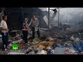 Dirt, ash & debris after apartment blocks shelled in E.Ukraine