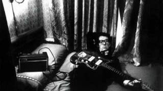 Watch Elvis Costello Strange video