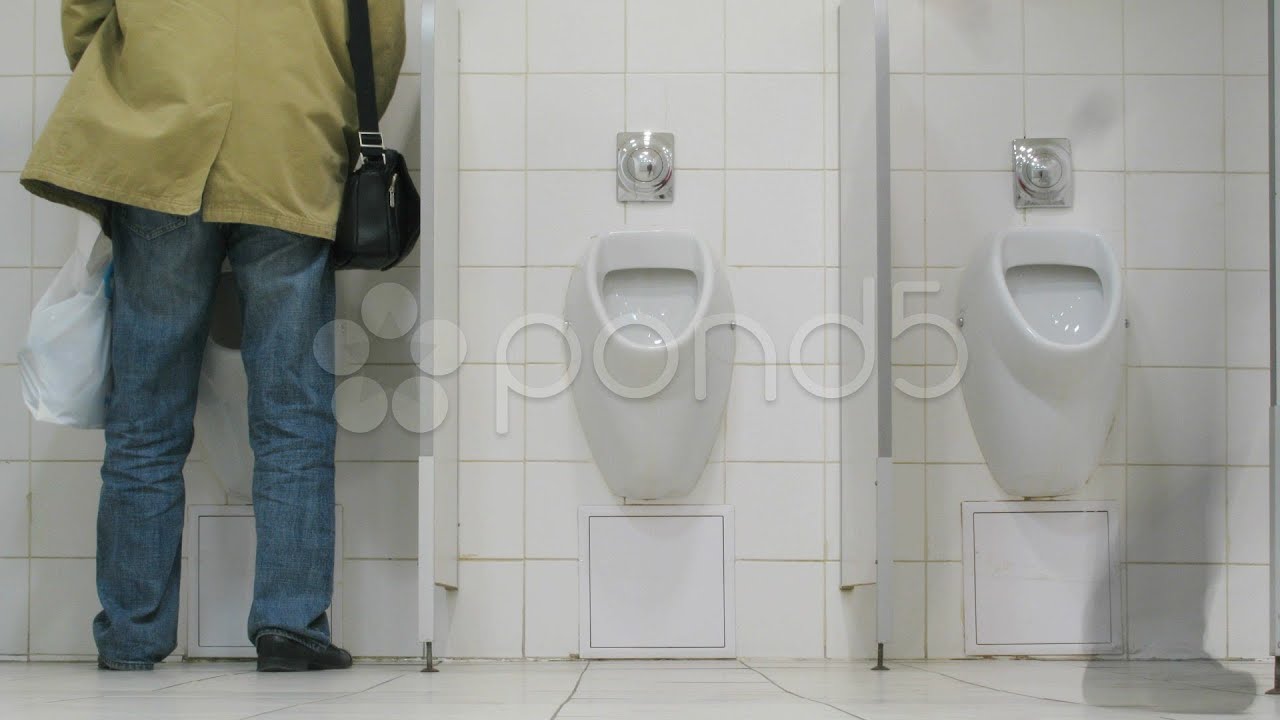 Shemale using urinal