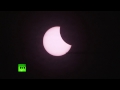 Spectacular: Plane flies in front of solar eclipse over Switzerland