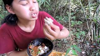 Pretty girl Frog eating in river - Pretty girl eating eating delicious