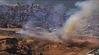 Crews fight Northern Calif. brush fire by highway
