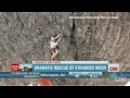 Rescuers work to save man stuck on cliff