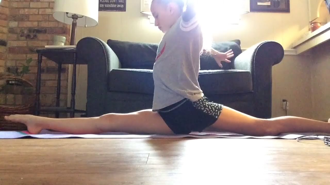 Spreading legs doing splits teen