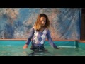 Cleo in purple pullover in the pool