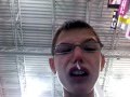 sick kid testing out a tablet in best buy
