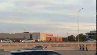 man running from traffic accident with bag