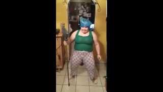 Lady dancing with a broom to a Puerto Rican song Lady dancing with a broom to a Puerto Rican song