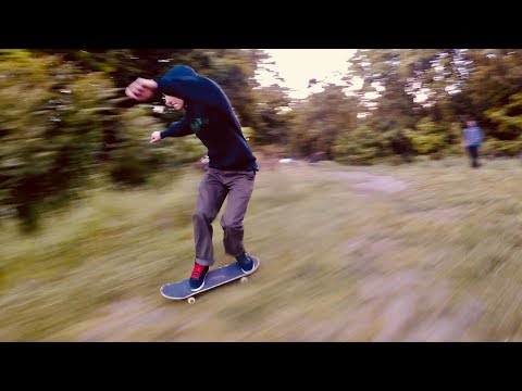 Skateboarders Bombing Dirt Hills