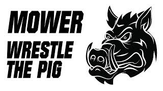 Watch Mower Wrestle With The Pig video