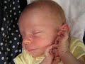 3 week old baby James waking up