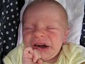 3 week old baby James waking up