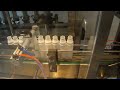 Video 10 heads linear type liquid piston filling and screw capping machine with quantificational filler