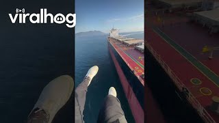 Paramotor Pilot Experiences Sudden Turbulence Over Cargo Ship || Viralhog